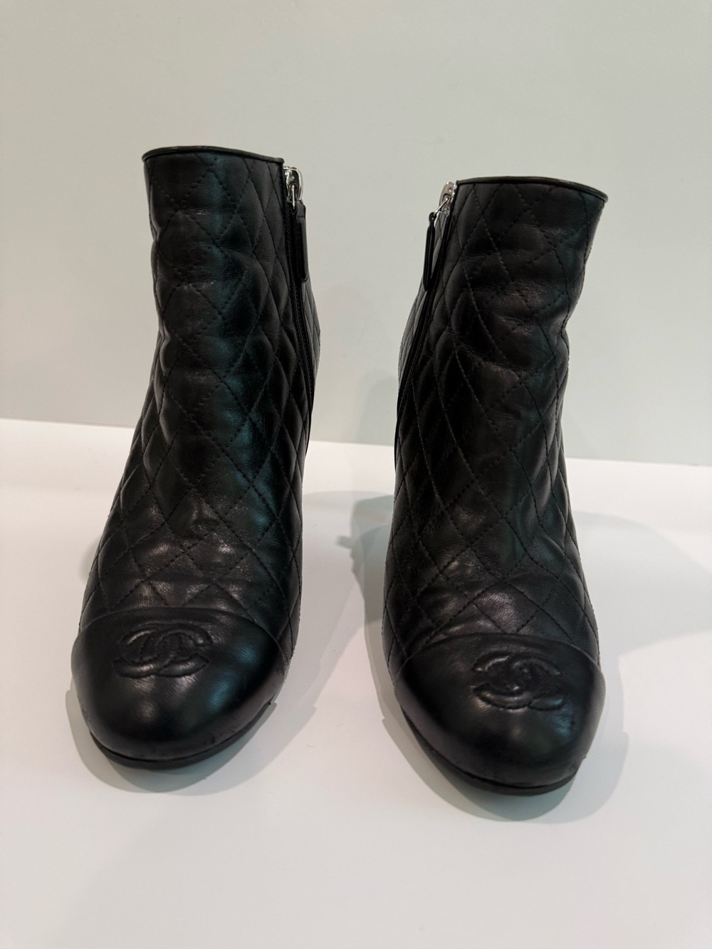 CHANEL Black Quilted Leather Ankle Booties with Embossed CC